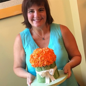 Heather holding bouquet cake